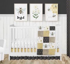 a baby's room with three pictures on the wall, and a crib