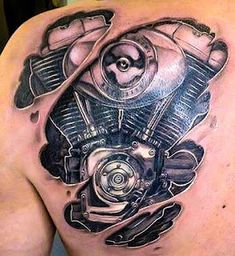 a man with a motorcycle engine tattoo on his back