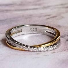 two gold and silver wedding bands with diamonds