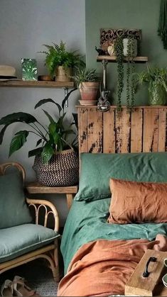 a bed room with a neatly made bed and lots of plants