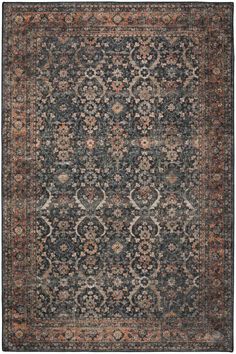 an antique rug with many different colors and patterns on the carpet, it is dark blue