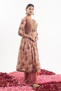 Peach anarkali with embroidered yoke and all over floral bloom prints. Paired with a pant and dupatta with floral butti prints and embroidered border. - Aza Fashions Festive Peach Anarkali Set With Straight Kurta, Peach Anarkali Traditional Wear For Festive Season, Fitted Peach Anarkali Set, Festive Peach Anarkali Traditional Wear, Peach Resham Embroidery Chanderi Anarkali Set, Peach Chanderi Anarkali Set With Resham Embroidery, Peach Anarkali Kurta With Chikankari Embroidery, Peach Anarkali Set With Zari Work Straight Kurta, Anarkali Style Peach Palazzo Set With Resham Embroidery