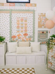 a room with white furniture and decorations on the wall