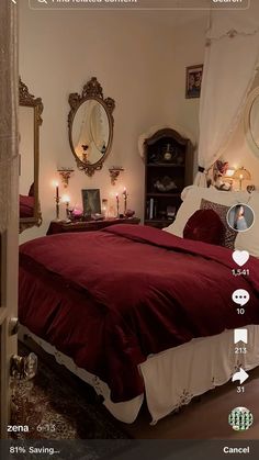 an image of a bedroom setting with candles on the nightstands and red bedding