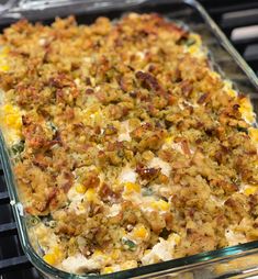 a casserole dish filled with corn and meat