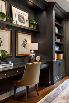 a home office with black walls and wooden floors