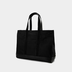 This spacious tote bag from Alexander McQueen combines practicality and style. Ideal for office use or travel, it includes two top handles and an adjustable shoulder strap for customized carrying convenience.

- Dimensions: 45cm x 34cm x 12cm  
- Material: Synthetic fabric Luxury Black Canvas Bag For Everyday, Chic Black Canvas Travel Bag, Functional Business Tote Shoulder Bag, Classic Black Rectangular Canvas Bag, Black Tote Briefcase For Work, Luxury Black Rectangular Canvas Bag, Functional Tote Shoulder Bag For Work, Elegant Black Travel Bag For Work, Business Travel Tote Bag With Top Handle