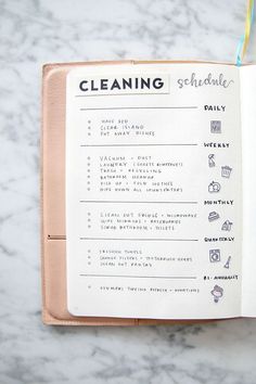 an open book with cleaning schedule on it