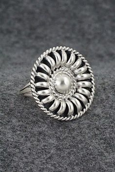 This satin finish sterling silver ring was made by Navajo silversmith Manuel Johnson.Size: 8Length: 1 1/8"Width: 1 1/8"Free shipping on all orders! We ship with USPS and always include tracking. All orders ship within a day of payment.Returns are accepted up to 30 days after you receive your order. Just send us a message. Our shop offers cash back or store credit. The item must be returned in new condition. Silver Bohemian Concho Rings, Bohemian Silver Concho Rings, Silver Concho Rings Perfect For Gifts, Silver Concho Rings For Gift, Nickel-free Silver Rings In Southwestern Style, Nickel-free Silver Southwestern Rings, Nickel-free Southwestern Silver Rings, Adjustable Silver Concho Rings, Western Sterling Silver Concho Rings