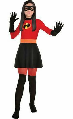 a girl dressed as the incredible spider - woman is standing in front of a white background