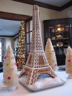 the eiffel tower is made out of plastic and decorated with christmas tree decorations