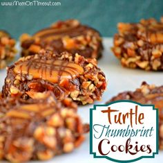 chocolate turtle thumbnut cookies with peanut butter on top