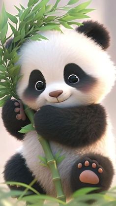 a panda bear sitting on top of a bamboo tree holding onto a green leafy branch