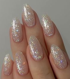 Embrace the enchantment of your special day with these glittery nails that mirror the sparkle in your eyes. Just like your love story, these shimmering details are meant to shine, adding an extra touch of magic to every gesture as you embark on a new journey together. Glittery Bridal Nails, Iredesant Pearl Nails, Sparkly Bridal Nails, Bridal Nails Glitter, 2023 Nails Ideas, Glitter Nail Ideas, Nails Ideas 2023, Sparkly Nail Designs, Bridal Era