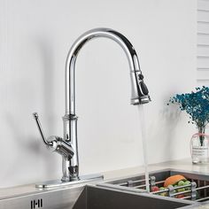 a kitchen sink with a faucet running water