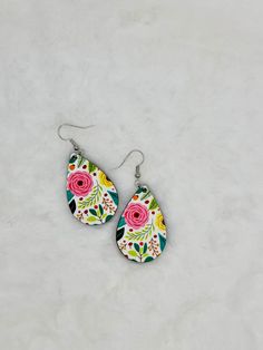 "Get ready to bloom with our Boho Floral Teardrop Earrings These stunners, sized at 1\" x 1.57\", bring a dash of nature's magic to your ears. Dive into the fun with a boho floral design and enjoy irritation-free wear with lightweight construction. Please note that the fish hook hardware is not hypoallergenic. What's more? They're feather-light for all-day comfort! Whether it's a special day or just a \"treat yourself\" moment, these earrings are your ticket to floral fabulousness - because who says accessories can't be both chic and playful? 🌸✨" White Teardrop Earrings For Mother's Day, White Teardrop Flower Earrings, Multicolor Teardrop Flower Earrings With Ear Wire, Multicolor Teardrop Flower Earrings As Gift, Whimsical Hand Painted Drop Earrings, Bohemian Teardrop Hand Painted Earrings, Bohemian Hand Painted Flower Earrings, Bohemian Pink Hand Painted Earrings, Multicolor Teardrop Flower Earrings