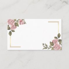 a business card with pink roses and gold trimmings on white marble background,