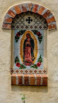 an image of the virgin mary on a wall