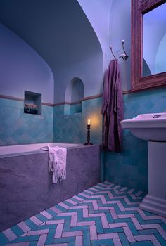 a bath room with a sink and a bath tub