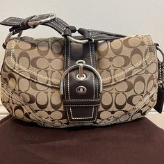 Vintage Coach Soho Small Flap Shoulder Bag New W/ Dust Bag. No Tag. Never Worn. Throw It Back To Y2k With This Authentic Loved Favorite (Because Icons Live 4eva). This Bag Was Introduced In 2003. Signature Jacquard Flap Closure, Fabric Lining Strap With 7 1/2" Drop 10 1/4" (L) X 6 1/4" (H) X 3" (W) Style No. Cm355 Designer Rectangular Hobo Bag With Silver-tone Hardware, Designer Rectangular Hobo Bag With Branded Hardware, Designer Hobo Bag With Silver-tone Hardware, Designer Beige Shoulder Bag With Silver-tone Hardware, Coach Beige Shoulder Bag With Silver-tone Hardware, Designer Coach Shoulder Bag With Silver-tone Hardware, Designer Coach Hobo Bag, Designer Coach Shoulder Bag, Luxury Coach Hobo Bag With Branded Hardware