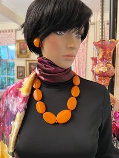 MARION GODART Paris Collier Ovales Plats Graduées Orange Stylish orange oval disks necklace Marion Godart Paris. Made of very hard beautiful orange gradated oval shiny art glass resin disks strung on strong synthetic wire. Disks are separated by small orange beads. Closes with a screw-cap closure of the same material. Length is 23 1/2 inch. The largest disk measures 1 7/8 x 1 14 inch. Old stock,never been worn. Very high quality as can be expected from this brand. Matching earrings and bracelets Vintage Handmade Necklaces With Oval Cabochon, Vintage Handmade Oval Cabochon Necklaces, Vintage Handmade Oval Cabochon Necklace, Traditional Yellow Oval Jewelry, Traditional Oval Yellow Jewelry, Classic Orange Oval Jewelry, Vintage Jewelry With Polished Oval Beads, Yellow Oval Vintage Jewelry, Amber Oval Pendant Necklace