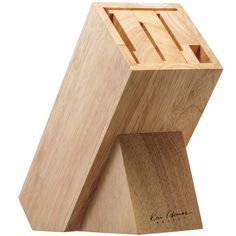 a wooden block with a piece of wood in it's center and the word love written on it