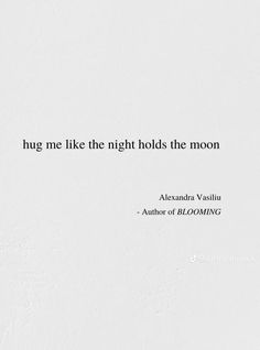 a white wall with a quote on it that says hug me like the night holds the moon