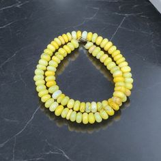 Gemstone Name: Yellow Opal Beads Size: 8mm-9mm Approx.  Beads Shape: Smooth Rondelle Material: Gemstone, 925 Sterling Silver Closure: Lobster Clasp Length: 18" Inch Handmade: Yes 8mm Rondelle Beads For Jewelry Making, 8mm Amber Beads For Jewelry Making, Amber 8mm Beads For Jewelry Making, Yellow Faceted Beaded Necklace, Yellow Faceted Beads Round Necklace, Yellow Faceted Beads Beaded Necklace, Yellow Faceted Beaded Necklaces, Yellow Faceted Beads Necklace, Yellow Beaded Gemstone Bracelets