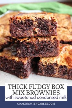 thick fudge box mix brownies with sweetened condensed milk are stacked on top of each other