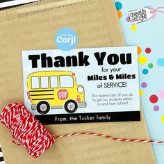 a thank card with a school bus on it next to twine and sprinkles