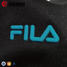 the back of a black jacket with blue letters that read,'fila '