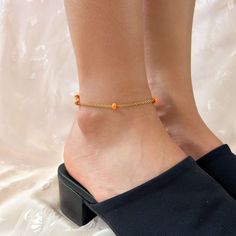 Stainless steel chain anklet featuring bright orange beads ❀❀ INFO: ❀❀ * Handmade in Southern California ♡ * Stainless steel, tarnish resistant material * 1.5" extender chain for an adjustable fit * Gorgeous bright orange beads ❀❀ MODEL SIZE REFERENCE: ❀❀ Measurement above ankle bone: 7.75" Measurement at ankle bone: 8" Wearing an 8.5" length anklet ❀❀ SHIPPING & PROCESSING: ❀❀ Anklets are MADE TO ORDER Please see "Shipping and returns policy" on this page for the latest processing times and estimated delivery dates. Estimated shipping is also shown in your shopping cart. Thank you!♡ Adjustable Orange Beaded Chain Bracelets, Orange Beaded Chain Bracelet As A Gift, Orange Beaded Bracelets, Ankle Bones, Chain Anklet, Anklet Jewelry, Body Jewellery, Steel Chain, Bright Orange