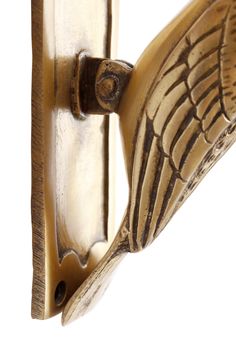 an image of a door handle with wings on it