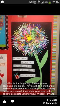 a bulletin board with some writing on it and a flower made out of crayons