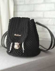 Crochet backpack for women . Hand knitted from 100% cotton cord. Bag straps and bottom are made of eco-leather Closes with lace and metal clasp. Adjustable shoulder straps - 40- 80cm (15,75- 31,5in.).  The size: width (bottom diameter) -22 cm. (7,87 in) height (backpack depth)- 23cm. (9,06 in) Care: can be washed in hand wash (30 oC). Dry in a straightened form in horizontal arrangement. All my products, I packing quality before shipping. But during transportation, their deformation is possible. Everyday Crochet Backpack With Adjustable Strap, Handmade Black Backpack For Travel, Handmade Black Travel Backpack, Handmade Casual Backpack For Everyday Use, Handmade Casual Everyday Backpack, Casual Handmade Everyday Backpack, Casual Everyday Handmade Backpack, Backpack Crochet, Crochet Backpack