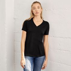 Buy the BELLA+CANVAS® Women's Short Sleeve V-Neck T-Shirt at Michaels. com. This soft cotton t-shirt will be a cool and casual addition to your collection. This soft cotton t-shirt will be a cool and casual addition to your collection. Featuring a v-neck, short sleeves and side-seams, it is designed with a relaxed fit making it comfortable. Pick your favorite color and personalize this t-shirt with your own designs. Details: Available in assorted colors and sizes Relaxed women's fit Short sleeve Black V-neck T-shirt For Everyday, Black V-neck T-shirt With Relaxed Fit, Black Relaxed Fit V-neck T-shirt, Clothing Company, Workout Shorts, Cotton T Shirt, Favorite Color, Bella Canvas, Cotton Tshirt