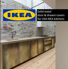 an ikea advertisement is displayed on the wall next to a kitchen counter and sink