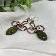 "Oxidized copper wire earrings with beautiful green gemstones for casual and business casual wear. Perfect earth tones:) These earrings are hand forged from copper wire and embellished with green gemstones. They are oxidized and polished to create this nice antique finish which works very well with the green stone. The earrings are finished with Sterling silver ear wire to avoid any allergic reactions one may have to the copper wire. They will be shipped in a little gift box ready to be given aw Unique Hand Forged Green Earrings, Green Wire Wrapped Metal Earrings, Green Bohemian Earrings With Copper Wire, Bohemian Green Earrings With Copper Wire, Green Bohemian Copper Wire Earrings, Earthy Green Wire Wrapped Jewelry, Green Copper Wire Earrings Gift, Handmade Copper Green Earrings, Handmade Green Copper Earrings