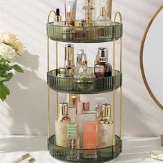 a three tiered shelf with cosmetics and makeup products on it