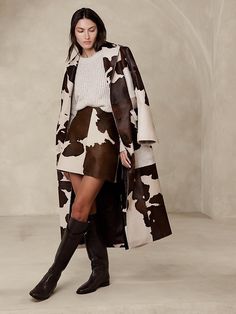 Saw this on Banana Republic: Western Luxury Fashion, Luxury Western Outfit, Cow Print Clothing, Western High Fashion, Cow Print Outfit Ideas, Cow Print Fashion, Leather Skirt With Boots, Cowgirl Lifestyle, Western Inspired Outfits