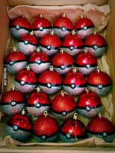 a box filled with lots of shiny red and silver ornaments