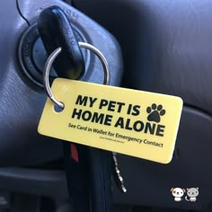 a yellow sign that says, my pet is home alone see card in wallet for emergency contact