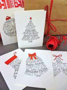 four christmas cards with handwritten words and a red ribbon tied around the top one