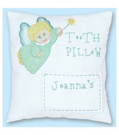 a white pillow with a little angel on it and the words tooth plow written in green