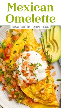 mexican omelette on a plate with avocado and sour cream in the background