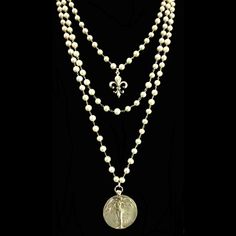 The Seraphim are Angels of the Highest Order and this necklace is duly name. It is a total of 78" of Freshwater Pearls that began as a custom design and collaboration with one of our very best customers. We have worked together for a a few years now and when special events come up we synthesize ideas to find the perfect gift. Now, with our own Whispering Goddess design studio, the options we can create together are endless. Muriel the Angel of Peace and Victory hangs from the longest strand. Sto Adventurine Necklace, Trinity Necklace, Heart Cross Necklace, Sacred Jewelry, Angel Necklace, Medallion Necklace, Dope Jewelry, Jewelry Lookbook, Freshwater Pearl Necklaces