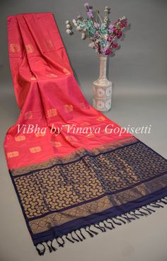 This Dark Pink and Blue Kanchi Soft Silk Saree and Blouse is crafted from luxurious handloom silk for a traditional look and feel. Perfect for weddings and festivals, it's soft and comfortable to wear for all age groups. The beautiful combination of colors makes this saree a chic addition to any wardrobe. The accompanying saree blouse is tailored and embellished with embroidered sleeves and handcrafted dori and tassels at the back. The attention to detail further enhances it and gives the blouse Silk Blouse Piece For Diwali, Cotton Silk Traditional Wear With Zari Weaving For Celebration, Silk Traditional Wear With Pallu For Celebrations, Pink Cotton Silk Traditional Wear For Celebration, Handloom Traditional Wear For Celebration, Celebration Silk Traditional Wear With Pallu, Traditional Silk Wear For Celebration, Handloom Silk Blouse Piece For Traditional Ceremonies, Traditional Cotton Silk Wear With Weaving For Festivals