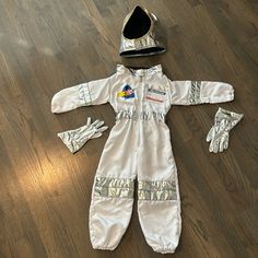 an astronaut costume is laying on the floor