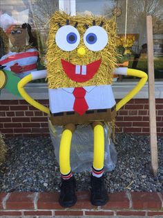 a man made out of hay standing in front of a store window wearing a suit and tie