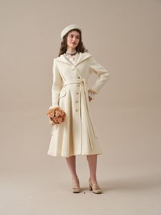 "Always traveling from one place to another? You need a coat that can handle any weather. With a hooded design, this wool coat is the perfect solution. Crafted from Premium wool, this piece is detailed with a distinct asymmetrical front fastening that will add an extra touch of elegance to your collection. Undoubtedly your new favourite. Create a timeless and versatile addition in soft tones.Grounded with practical elements such as the two two deep pockets, a single-breasted design, a classic hood. The detachable belt creates a sleek silhouette that offers multiple styling options. We've upgraded the wool fabric and used a handmade composite lining to enhance comfort. Even on the coldest days, you can stay elegant and chic in our coat, giving you with the perfect blend of functionality and Cream Fitted Long Wool Coat, Fitted Long Cream Wool Coat, Winter Cream Single Breasted Wool Coat, Cream Single Breasted Pea Coat For Winter, Cream Single-breasted Pea Coat For Winter, Cream Belted Winter Outerwear, Classic Cream Wool Coat For Winter, Cream Belted Outerwear For Winter, Hooded Wool Coat